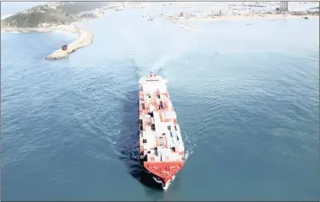  ?? PICTURE: PETE VAN SPEK ?? A fully laden container ship leaves Durban harbour. Durban is already one of the world’s most expensive ports for container handling, even before an expensive new foreign loan for overpriced infrastruc­ture is factored in.