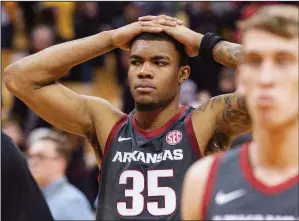  ?? (AP/L.G. Patterson) ?? Arkansas forward Reggie Chaney (35) walks off the court after the Razorbacks’ 83-79 loss in overtime to Missouri on Saturday in Columbia, Mo. Chaney scored 17 points and grabbed 11 rebounds.