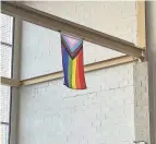  ?? BLOOM PHOTO COURTESY OF ALLIE ?? After being torn down, an LGBTQ+ Pride flag was hung higher in a hallway at Stow-munroe Falls High School, students said.