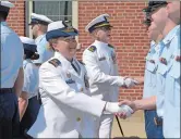  ?? DANA JENSEN THE DAY ?? Lt. Nina McDonald, left, and Lt. Robert Garris, right, review the crew of the U.S. Coast Guard Station New London on Wednesday during a change of command ceremony.