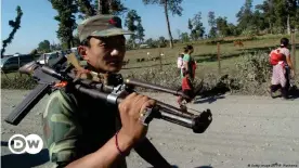  ??  ?? A Nepal's People's Liberation Army (PLA) soldier carries a weapon across his shoulders as he walks at the Shaktikhor cantonment site, Chitwan, in 2007