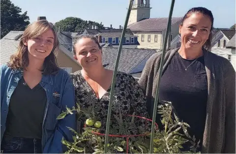  ?? ?? Lara Lepionka (center) began gardening to help feed her family in the midst of the
& o`^`ppelkҼ