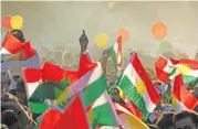  ?? (AFP) ?? Iraqi Kurds fly Kurdish flags during an event to urge people to vote for independen­ce in Arbil, in northern Iraq, on Friday