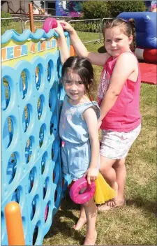  ?? Photos by Michelle Cooper Galvin ?? Hayley Casey and Lauren Sherborn, Sneem, enjoying the Inflatable Fun in the South Square at the Sneem Summer Festival on Saturday.