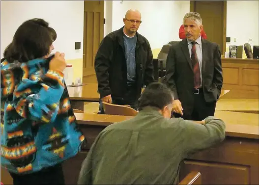  ?? John Miller ?? John Rael (center) was granted a conditiona­l discharge Tuesday (Dec. 4) in a plea agreement reached in a 2016 case that charged him with raping a 14-year-old Questa girl.