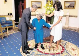  ?? LAWRENCE JACKSON The White House ?? President Barack Obama and First Lady Michelle Obama greet Virginia McLaurin, center, at the White House on Feb. 18, 2016.