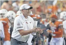  ??  ?? Tom Herman's Longhorns enter the Red River Showdown with a 2-1 record with a rout of UTEP, an overtime win at Texas Tech and a close loss to TCU. [AP PHOTO/CHUCK BURTON]