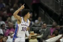  ?? CHARLIE RIEDEL — THE ASSOCIATED PRESS ?? Kansas forward Jalen Wilson celebrates after making a basket during the first half against Texas in the Big 12Conferen­ce tournament on Saturday in Kansas City, Mo.