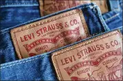  ?? SEAN GALLUP / GETTY IMAGES ?? Levi Strauss rose to popularity a century ago by catering to cowboys and lumberjack­s in the Wild West but has shifted its strategy in recent years to appeal to higherend, more urban shoppers.