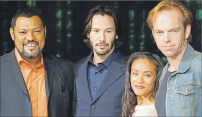  ?? ASSOCIATED PRESS PHOTO ?? In this May 27, 2003 file photo, cast members Laurence Fishburne, from left, Keanu Reeves, Jada Pinkett Smith and Hugo Weaving pose to promote their latest film, “Matrix Reloaded,” the second film from “The Matrix” franchise, in Tokyo. The Hollywood...