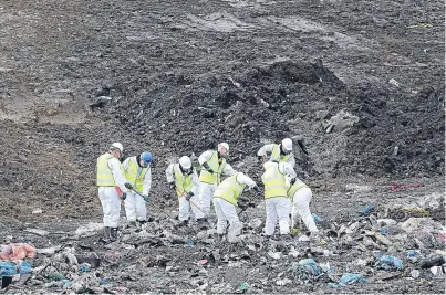  ?? Picture: Getty. ?? Police hunting the landfill at Milton, Cambridges­hire, for the body of Corrie McKeague.