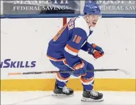  ?? Frank Franklin II / Associated Press ?? Anthony Beauvillie­r of the Islanders, playing in his 300th career game, celebrates after scoring a goal during the second period against Buffalo on Thursday in Uniondale.