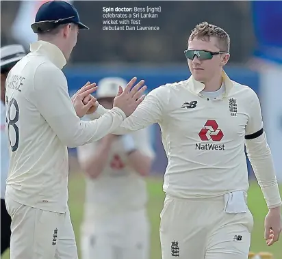  ?? PICTURES: ENGLAND CRICKET VIA TWITTER ?? Spin doctor: Bess (right) celebrates a Sri Lankan wicket with Test debutant Dan Lawrence