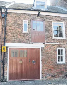  ?? Pictures: SWNS, ARCHANT ?? Entrances to the two flats, with Ken’s extra wide door on left