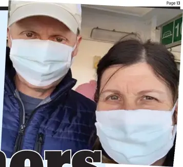  ??  ?? Long haul: John and Elaine Spencer in face masks