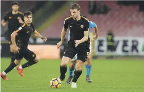  ?? Getty ?? Edin Dzeko returns from suspension to lead the Roma attack tonight