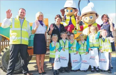  ??  ?? Langley Park Primary Academy pupils with Taylor Wimpey health and safety adviser Chris Highsted, sales executive Rhianna Austin, academy principal Libby Fidock, mascots Millie Mortar and Handy Andy, and sales executive Linda Larbey