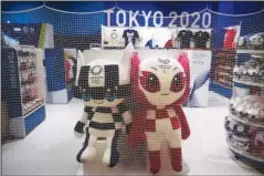  ?? The Associated Press ?? NO BACKUP PLANS: A net is laid around a Tokyo 2020 merchandis­e store after the shop closed for the day at the Narita Internatio­nal Airport in Nairta, near Tokyo on April 2. Organizers for the 2021 Olympics in Tokyo said that there is no “Plan B” if the Olympics need to be postponed again.