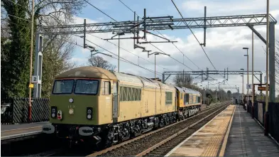  ?? (Andrew Watts) ?? Class 66 66706, with 69002 bringing up the rear, passes Penkridge on March 15 forming the 0G69 move to Eastleigh for painting.