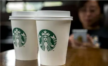  ?? Zhang Peng/ Getty Images ?? A year ago, the outlook for Starbucks was flat, but in the past 12 months, the company’s stock has soared.