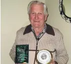  ?? PHOTO: THE NEW ZEALAND HERALD ?? Fred Inder holds some of the many awards he received.