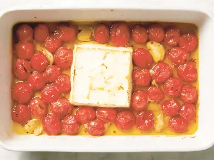  ?? TNS ?? This easy recipe, inspired by the feta pasta famous through Tiktok, features burst cherry tomatoes and a creamy sauce.