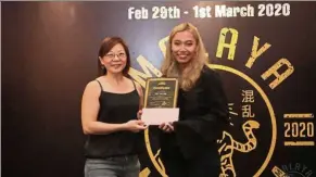  ??  ?? Chin (right) snatched two other firsts in Best Wilks Bench and Best Wilks Deadlift at the Malaya Mayhem 2020 in February, and second place in the Women Open category.
