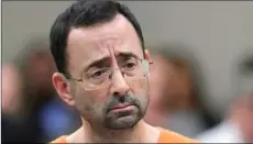  ??  ?? In this 2017 file photo, Dr. Larry Nassar appears in court for a plea hearing in Lansing, Mich. AP Photo/ PAul SAncyA