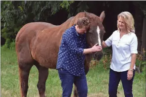  ??  ?? Shown are Brittney Hurley, left, and her mother, Edwina Hurley, and their pet Leo, a trail-riding horse.