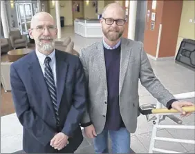  ?? Heather L. Meaney / Schenectad­y County Community College ?? Bret Wery, conductor of the Capital Region Wind Ensemble, and Dean William Bennett, an SCCC professor who will narrate one of the works on the upcoming program, “Release the Hounds.”