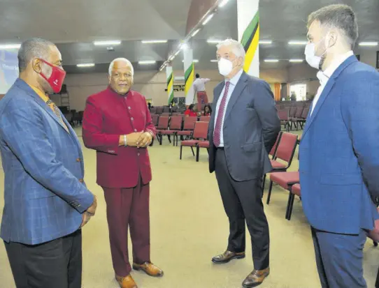  ??  ?? Senior pastor at Fellowship Tabernacle Rev Dr Al Miller (second left) greets Digicel Jamaica Chairman Harry Smith (left); Digicel Group CEO Oliver Coughlan (second right); and Digicel Jamaica CEO Jabbor Kayumov at yesterday’s service of thanksgivi­ng to commemorat­e the 20th anniversar­y of Digicel in Jamaica. The company switched on the first 2G signals in Jamaica on Thursday, April 19, 2001, and heralded the beginning of competitio­n and an advanced communicat­ions experience for individual consumers and businesses.