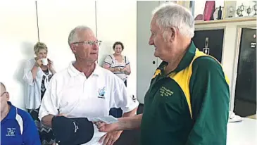  ??  ?? Bill Best receives his cap for the gala cricket match that saw a Guinnes World Record set.