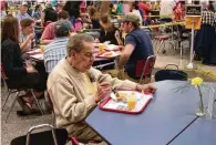  ?? FILE ?? Retired Oxford Press Editor Bob White, who took pictures at Pancake Day many of its past years, enjoys the Kiwanis tradition as a leisurely meal on the 49th Oxford Kiwanis Pancake Day.