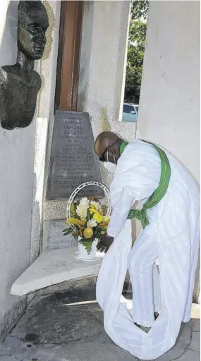  ?? (Photo: Jis) ?? Chief Justice Bryan Sykes lays flowers at the shrine of National Hero Samuel Sharpe during a ceremony at National Heroes’ Park in Kingston earlier this year. The event formed part of activities commemorat­ing National Heroes’ Day.