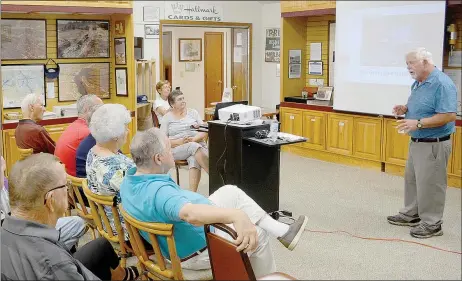  ?? Keith Bryant/The Weekly Vista ?? John Craig, right, speaks with a crowd gathered at the Bella Vista Historical Museum about his photograph­y work and his observatio­ns of Bella Vista’s great blue herons Sunday, Aug. 18.