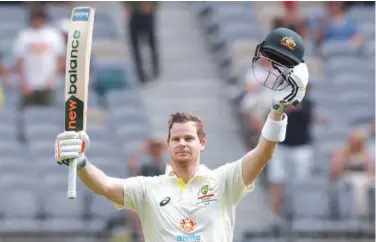  ?? R euters ?? ↑
Australia’s Steve Smith celebrates after reaching 200 runs during the second day of the first Test match against the West Indies.