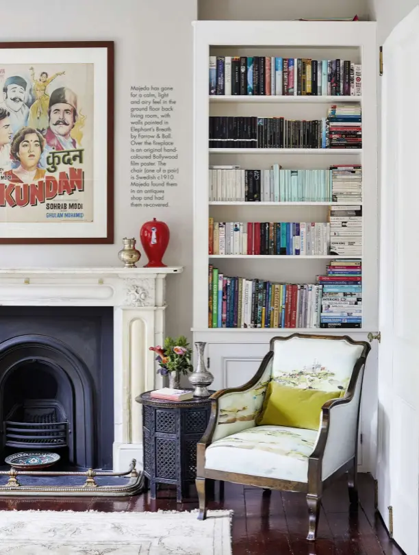  ??  ?? Majeda has gone for a calm, light and airy feel in the ground floor back living room, with walls painted in Elephant’s Breath by Farrow & Ball. Over the fireplace is an original handcolour­ed Bollywood film poster. The chair (one of a pair) is Swedish c1910. Majeda found them in an antiques shop and had them re-covered.
March 2021