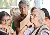  ??  ?? Pensioners wait to withdraw cash at the treasury office in Thiruvanan­thapuram on Thursday