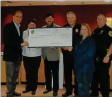  ??  ?? A waffle and ice cream sale at Souderton’s Aug. 21 Community Night Out raised $350 for the Chestnut Street Playground. Pictured are, standing from left, Pastor Gerry Clemmer, Souderton Mennonite Church; Dianna Fields, Souderton police administra­tive...