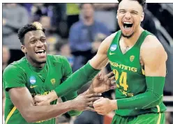  ?? Getty Images; USA TODAY Sports ?? DUCK AND COVER: Oregon’s Dillon Brooks helped silence a nearly all-Kansas crowd in Kansas City, Mo., helping send the Ducks to their first Final Four since winning the national championsh­ip in 1939.
