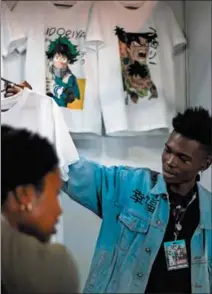  ?? ?? Fantasy fare: Tapelo Zama at the Afrogeek stall at last year’s Comic Con. On Sunday, he and partner Neo Mothoagae will bring the colourful world of comics to Soweto at the Uncle Tom’s Hall in Orlando West.