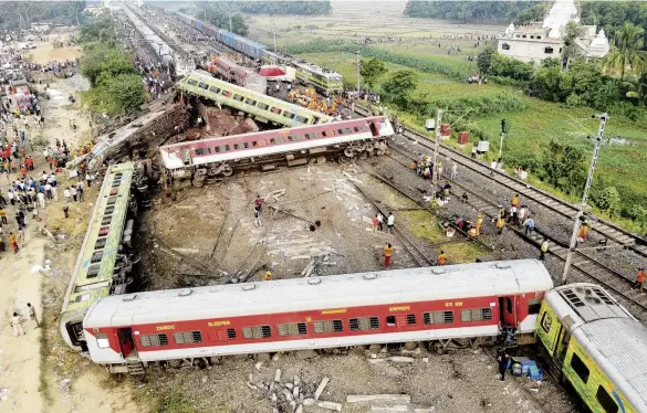  ?? PHOTO: REUTERS ?? Tragedy . . . A drone view shows derailed coaches after two passenger trains collided in Balasore district in the eastern state of Odisha, India, on Saturday.