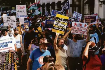  ?? Jose Luis Magana / Associated Press ?? Demonstrat­ors rally for voting rights on the 58th anniversar­y of the March on Washington. Activists held events across the country Saturday to call for broad protection­s of ballot access.