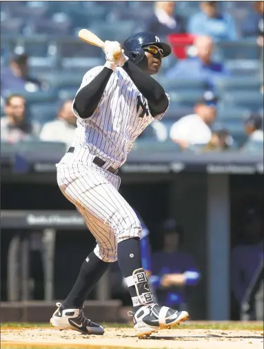  ?? Jim McIsaac / Getty Images ?? Didi Gregorius follows through on a first inning home run against Toronto at Yankee Stadium on Sunday.