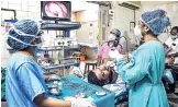  ??  ?? Doctors perform a diagnostic nasal endoscopy (DNE) on a patient to detect black fungus