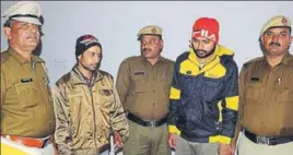  ?? HT PHOTO ?? The accused Mohit and his accomplice Sandeep in police custody in Rohtak on Saturday.