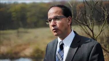  ?? DAKE KANG — THE ASSOCIATED PRESS FILE ?? Green Mayor Gerard Neugebauer speaks in front of wetlands where a proposed pipeline would run through in Green, Ohio. A Canadian company planning to replace a half-mile section of a high-pressure natural gas pipeline because it runs through an area more heavily populated than originally calculated has refreshed the ire of an Ohio community that fought to stop its constructi­on. Neugebauer in late 2017 told The Associated Press a study showed the pipeline would cost the city tens of millions of dollars in lost economic opportunit­ies.