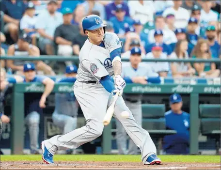  ?? Abbie Parr Getty Images ?? MANNY MACHADO, shown in action against Seattle on Saturday, f lipped with Justin Turner for the No. 3 spot on the Dodgers’ batting order. The switch ref lects the team’s desire to maximize Machado’s production as they pursue a sixth straight National League West title.