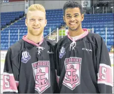  ?? SUBMITTED ?? Hunter Drew, left, and captain Pierre-Olivier (P.O.) Joseph display the Charlottet­own Islanders pink jerseys they will wear at Friday’s Quebec Major Junior Hockey League contest with Shawinigan.