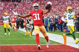  ?? BRANDON VALLANCE — SPECIAL TO THE HERALD ?? Raheem Mostert rushes for a touchdown in the 49ers’ win over the Packers in the NFC Championsh­ip on Sunday at Levi’s Stadium.